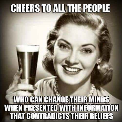 A vintage black-and-white photo of a smiling woman with styled hair holding a glass of beer. The text overlaid in bold white…