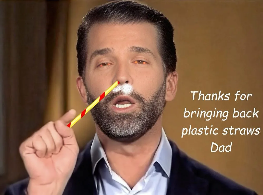 A man with a beard and dark hair holds a red and yellow striped plastic straw to his nose, with white powder visible around…
