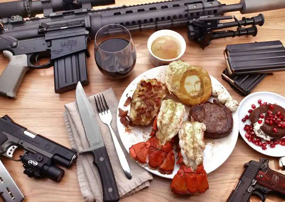 A lavish meal featuring lobster tails, steak, bacon, and a pancake with a face imprint is surrounded by multiple firearms…