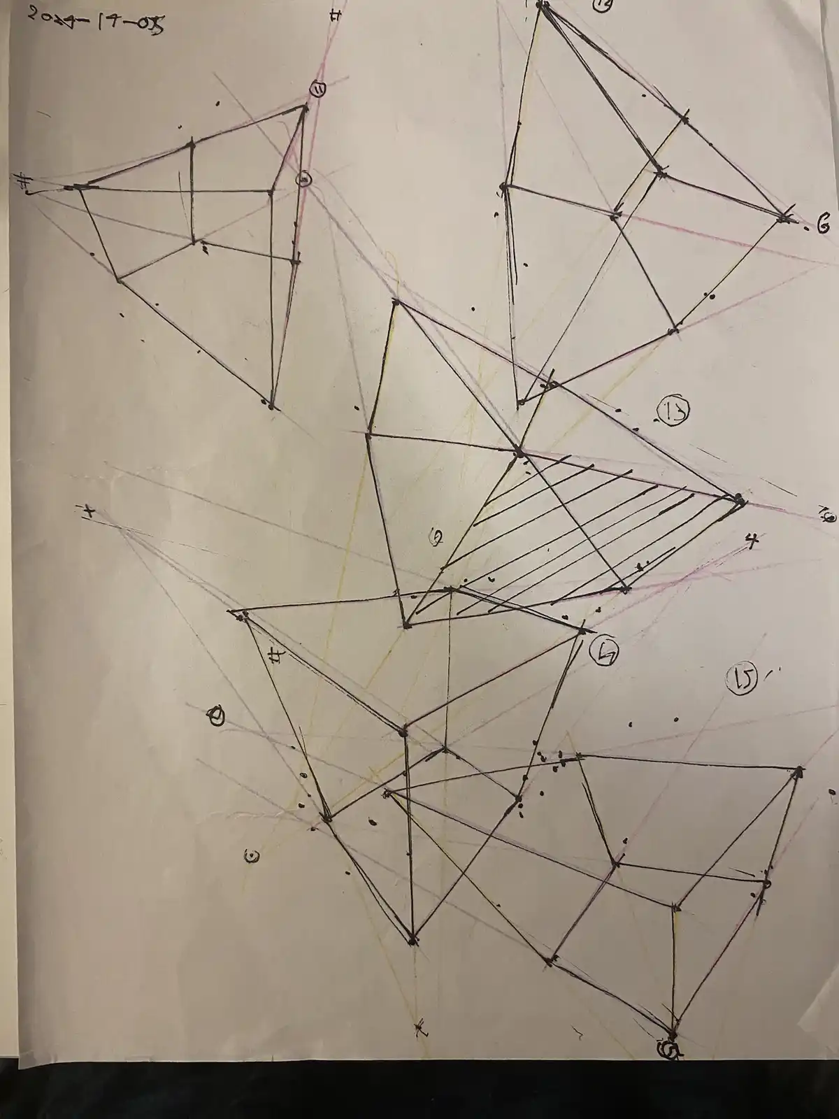 A hand-drawn, messy geometric diagram on paper, featuring numerous intersecting lines, triangles, and labeled points with…