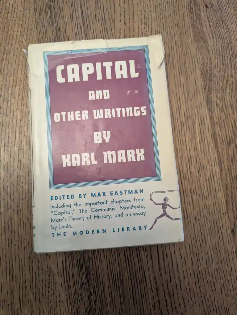 A vintage paperback book titled 'Capital and Other Writings by Karl Marx', edited by Max Eastman and published by The Modern…