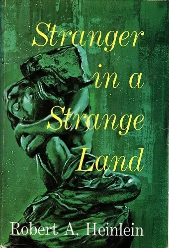The image shows the cover of the book 'Stranger in a Strange Land' by Robert A. Heinlein, featuring a green-toned…