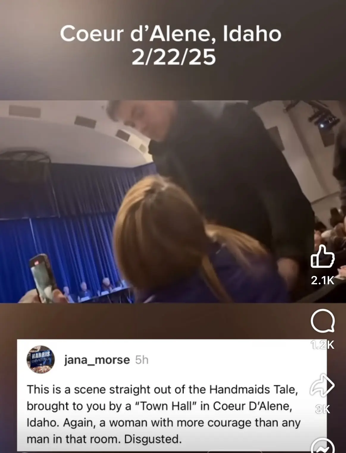 A screenshot of a social media post showing a woman with blonde hair being physically restrained by a man in a dark jacket…