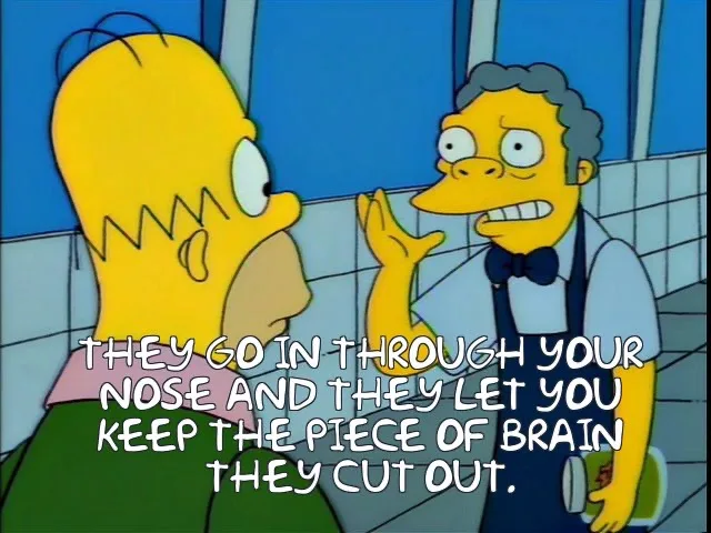In a bathroom scene from The Simpsons, Mr. Burns, with a manic expression, gestures toward Homer who looks shocked. White…