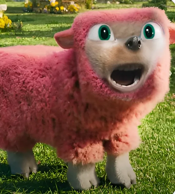 A cartoon sheep with bright green eyes and a wide open mouth stands on grass, wearing a fluffy pink costume that covers its…