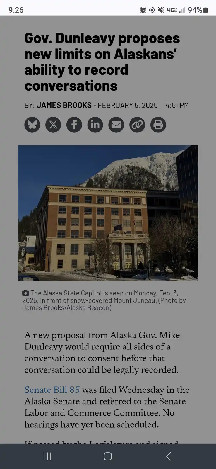 A screenshot of a news article from the Alaska Beacon dated February 5, 2025, shows a headline about Alaska Governor Mike…