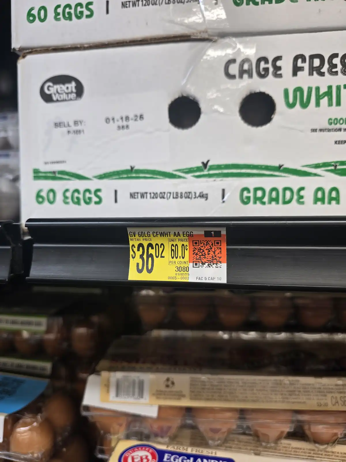 A close-up photo of a supermarket shelf displaying a large box of 'Great Value' cage-free white eggs, labeled as 60 eggs and…