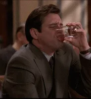 A six-panel sequence shows a man in a suit drinking from a glass, then reacting with increasing shock and disbelief. The…