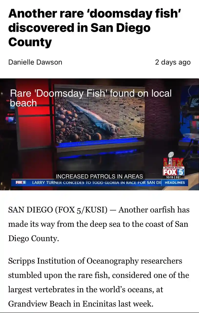 A screenshot of a Fox 5 news report shows a large, dead oarfish washed up on a pebbled beach, with overlaid text calling it…