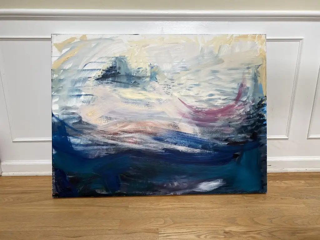 A large abstract painting with swirling blues, whites, and a single pinkish-red curved shape leaning against a white paneled…
