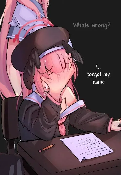 An anime-style girl with pink hair and a brown hat sits at a desk, covering her face with her hands in embarrassment while a…