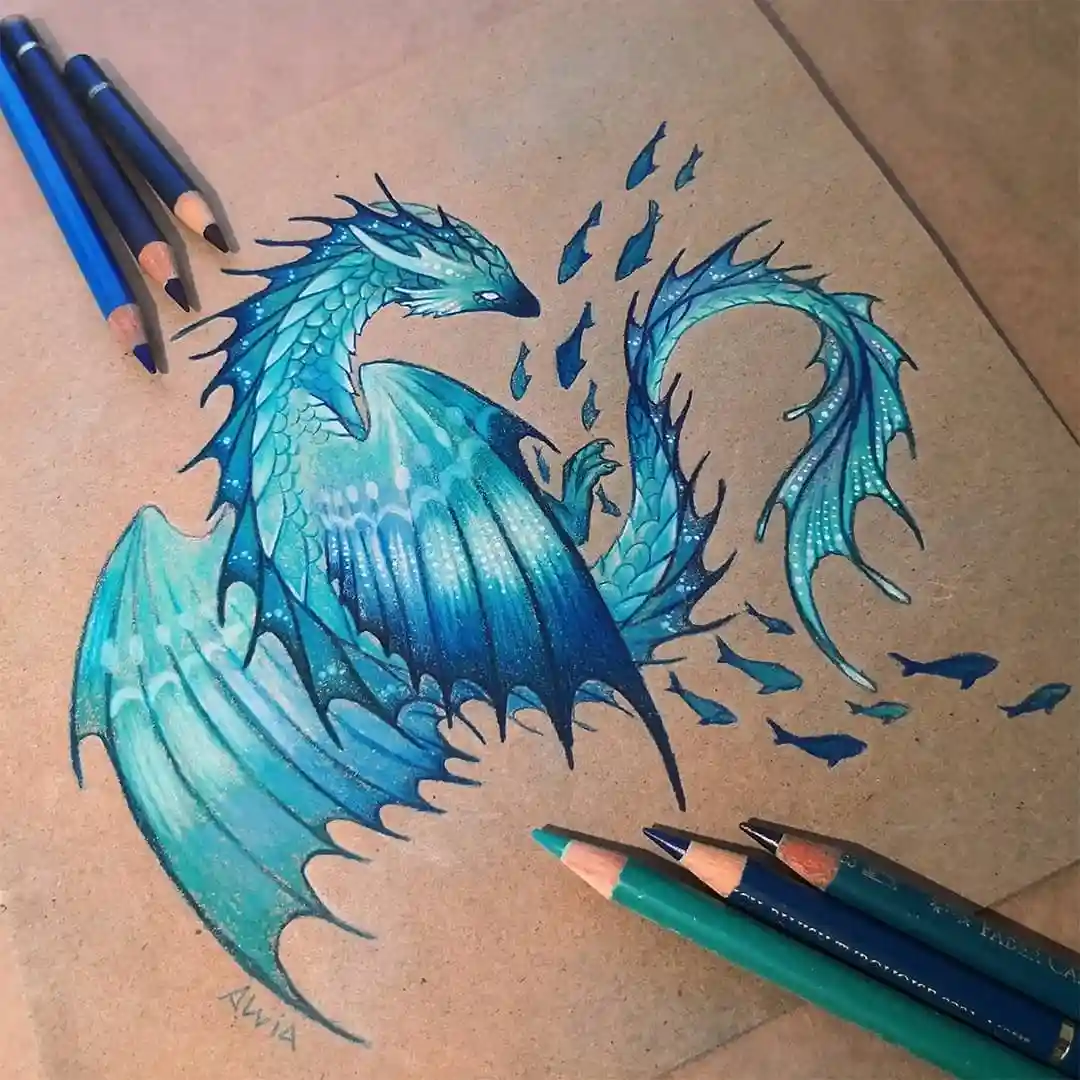 A detailed colored pencil drawing on brown paper shows a blue-scaled dragon with fish-like fins and a long, flowing tail…