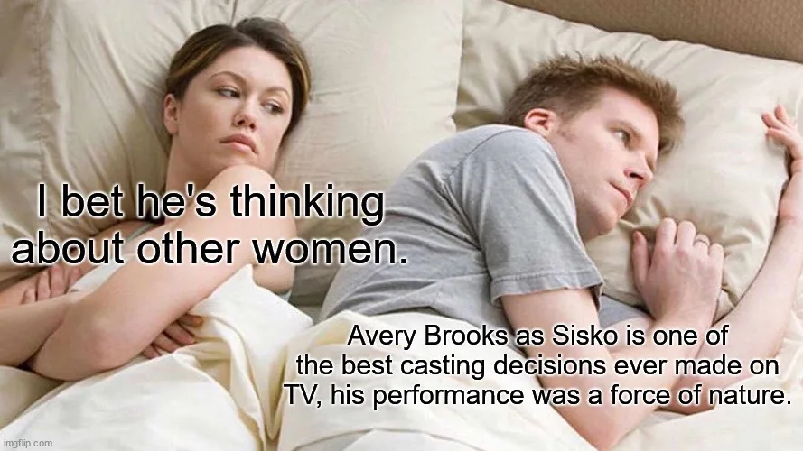 A woman lies in bed looking suspiciously at a man who is also in bed, with text overlaid that reads 'I bet he's thinking…