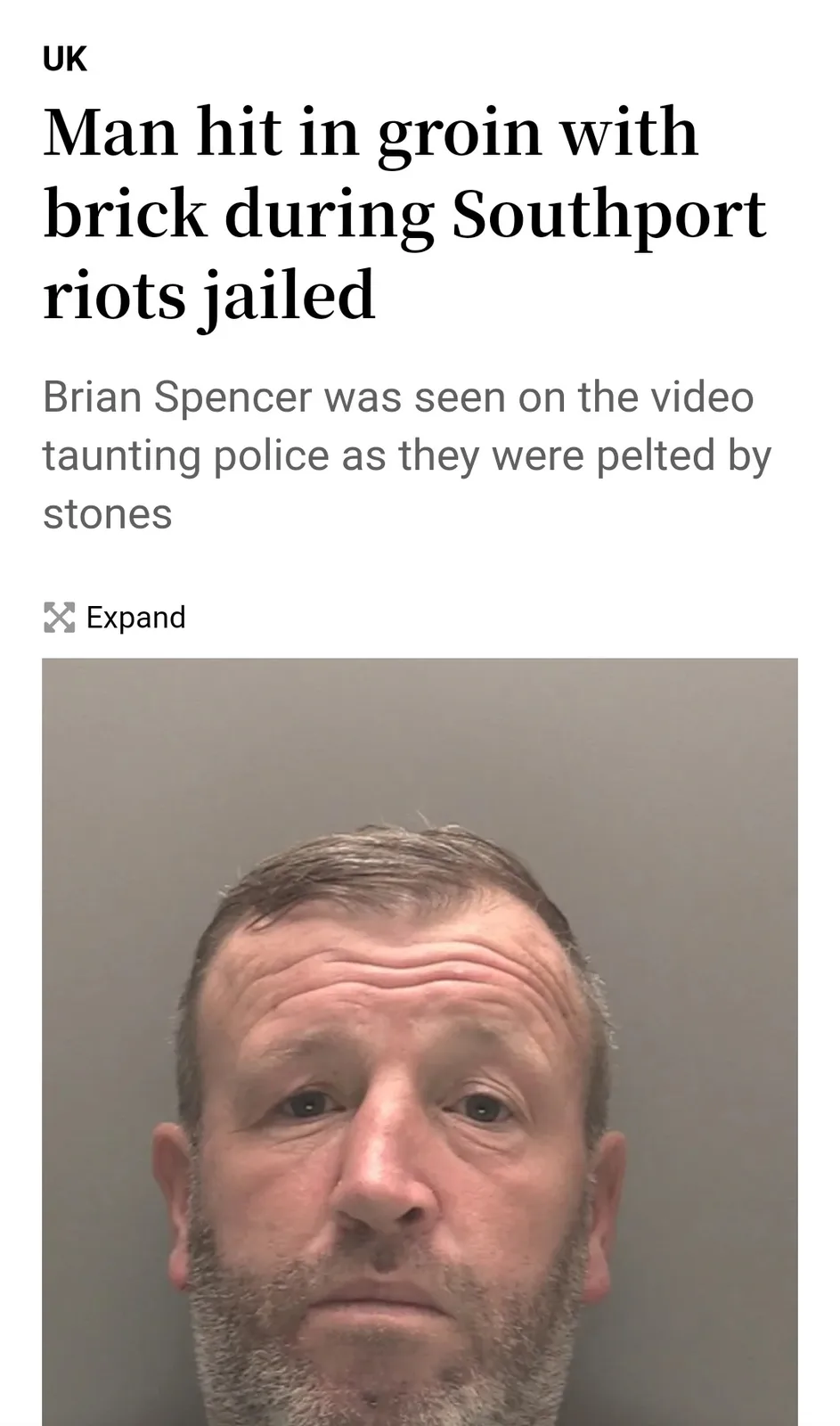 A mugshot of a man with short hair and a beard is shown below a news headline that reads 'Man hit in groin with brick during…