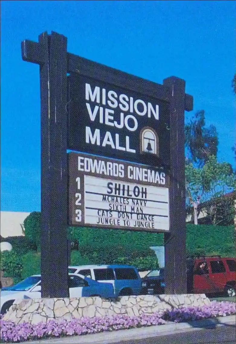 An outdoor sign for Mission Viejo Mall with Edwards Cinemas showing movie titles including 'SHILOH', 'MCHALES NAVY', 'SIXTH…