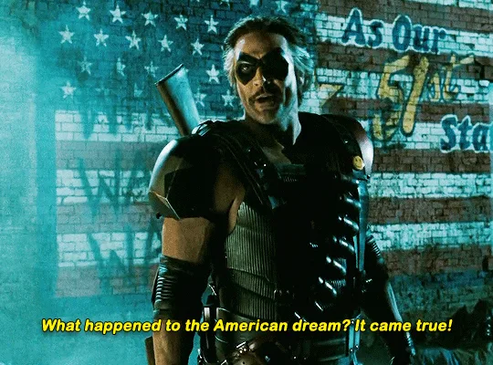 A six-panel meme featuring the character Deathstroke from the movie 'Suicide Squad' (2016), shown in a black tactical suit…