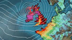 A weather map shows the United Kingdom in the center of a large, intense low-pressure system marked with a big red 'L'. The…