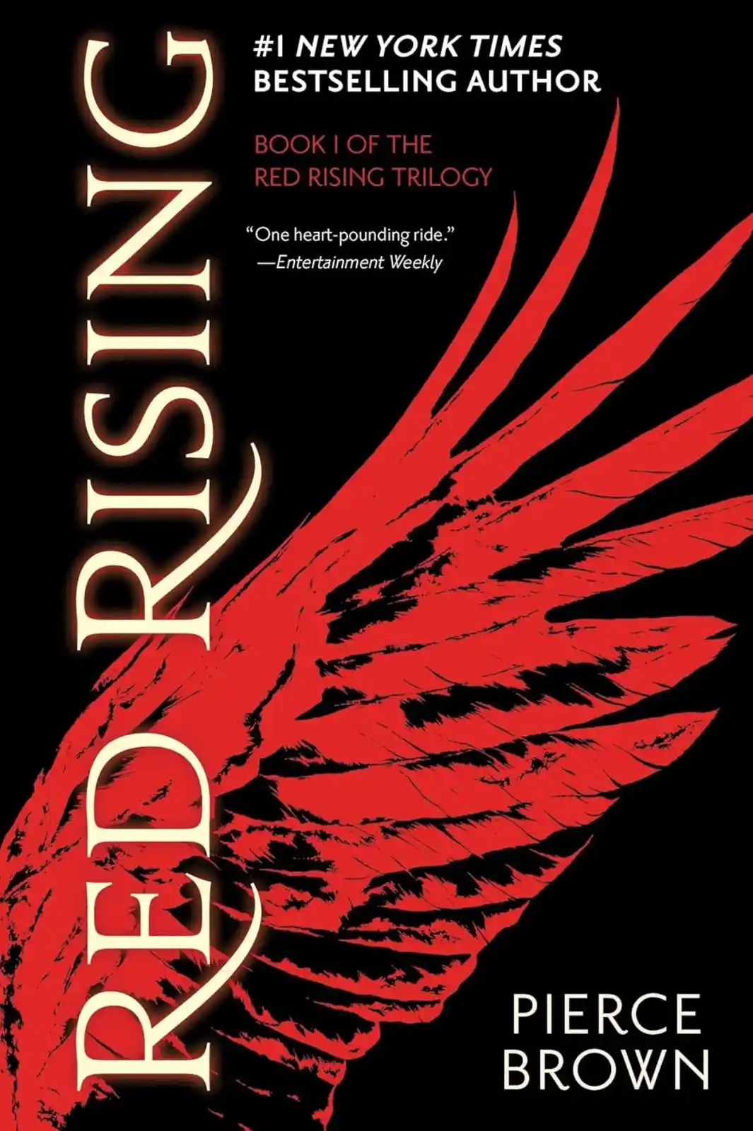 The image shows the book cover for 'Red Rising' by Pierce Brown, featuring a large red wing against a black background. The…