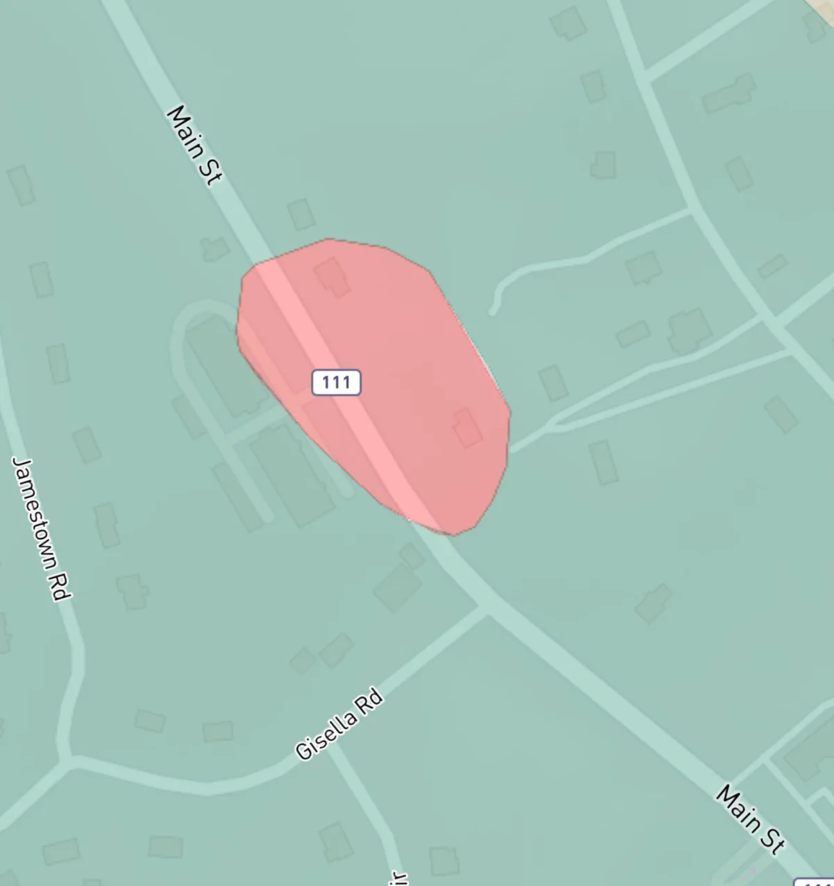 A map view shows a pink, oddly shaped polygon labeled '111' centered on a street intersection, with nearby roads named Main…