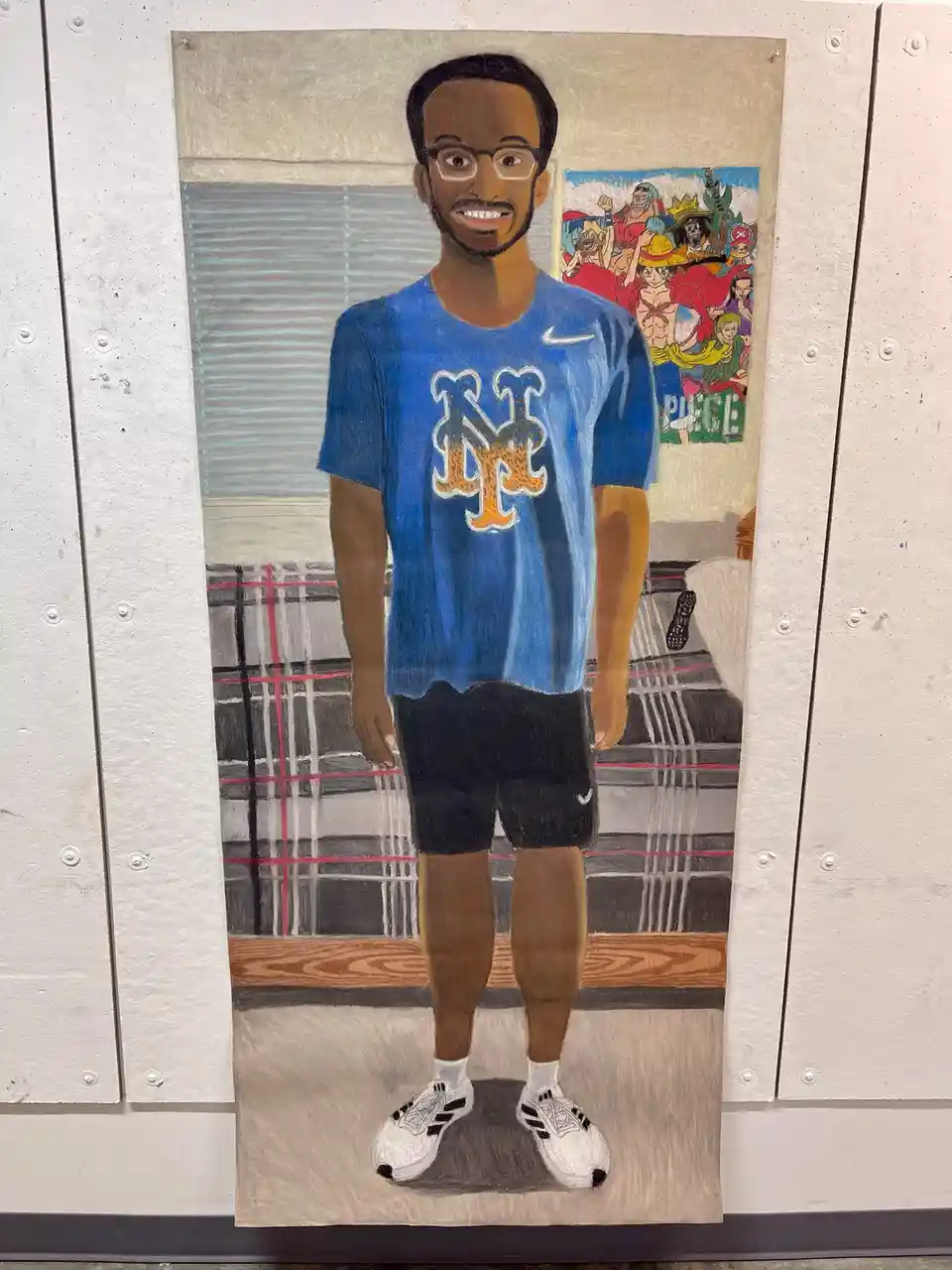 A hand-drawn portrait of a smiling Black man with glasses, wearing a blue New York Mets t-shirt, black shorts, and white…