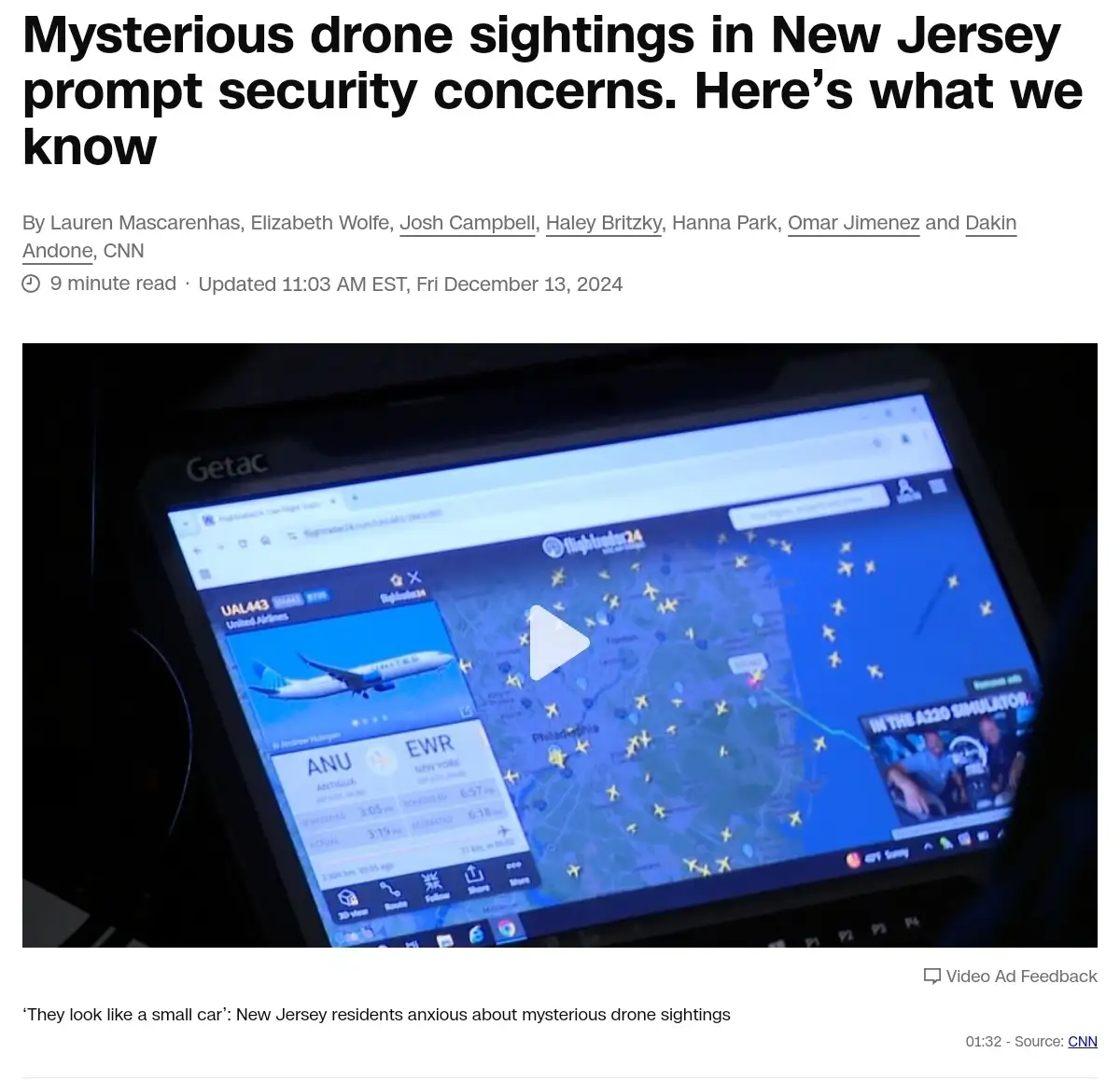 A screenshot of a CNN news article about mysterious drone sightings in New Jersey, showing a laptop screen displaying a…