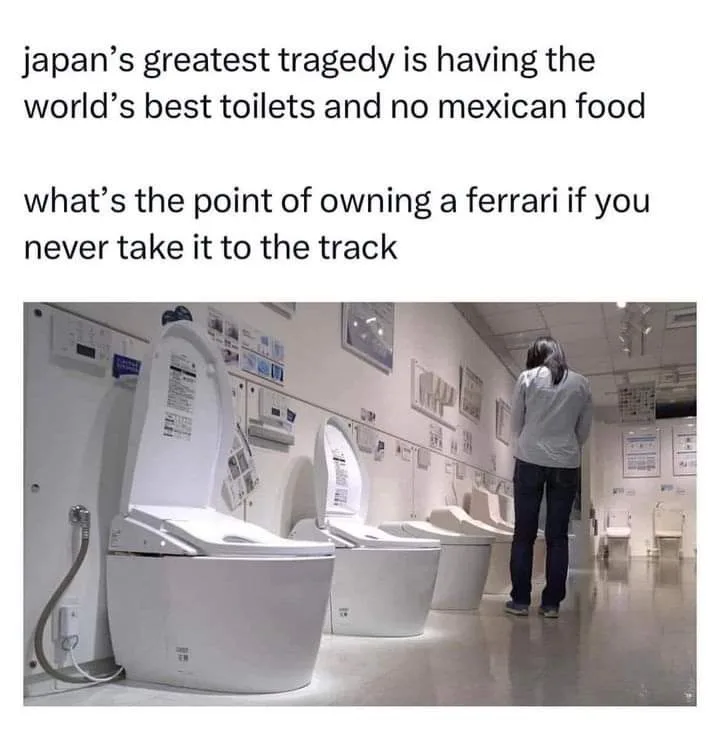 A person stands in a brightly lit showroom filled with rows of high-tech, white Japanese smart toilets, all with lids open…