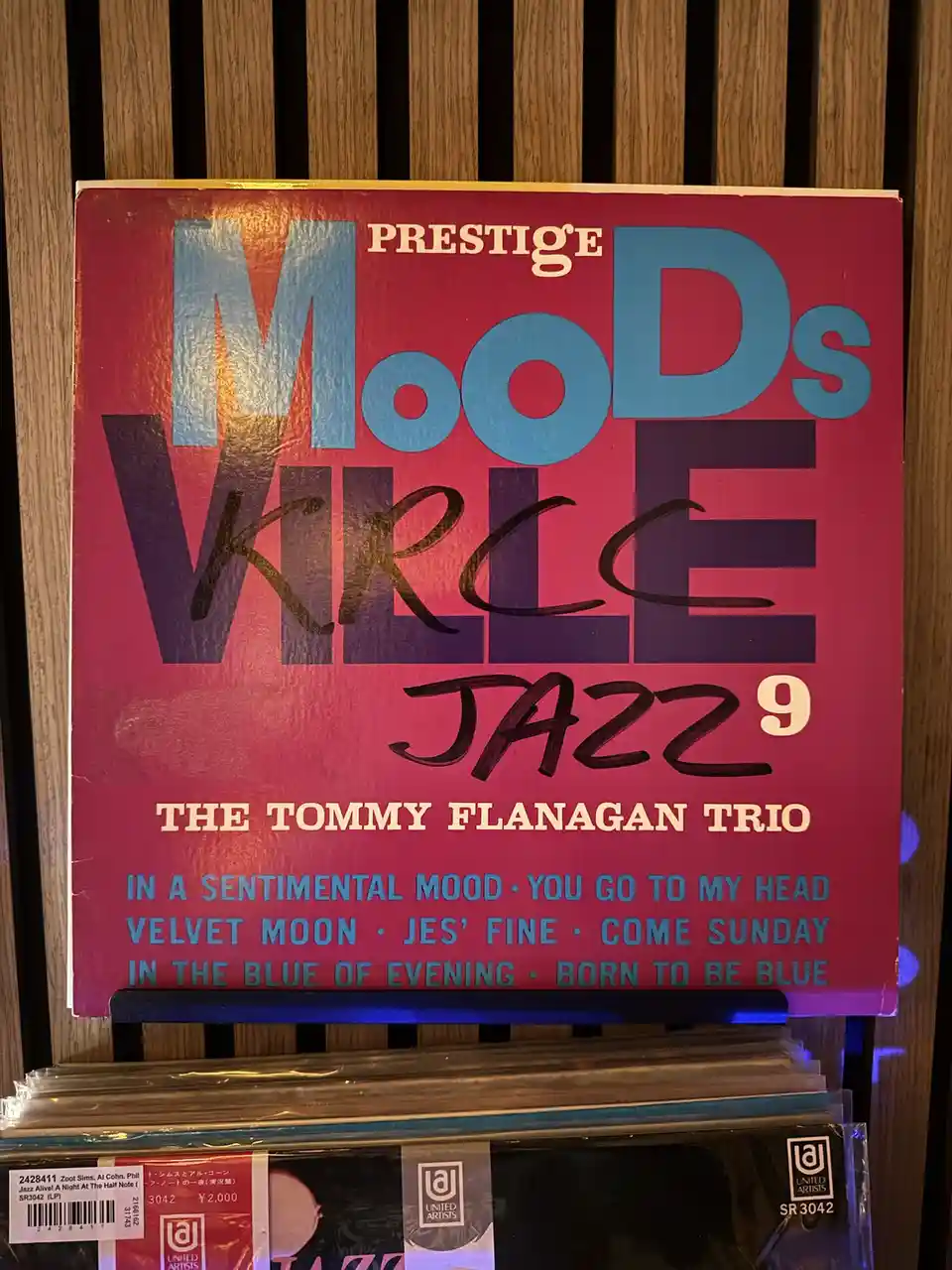 A red Prestige jazz album cover for 'Moods Vol. 9' by The Tommy Flanagan Trio, with the letters 'KRC' handwritten in black…
