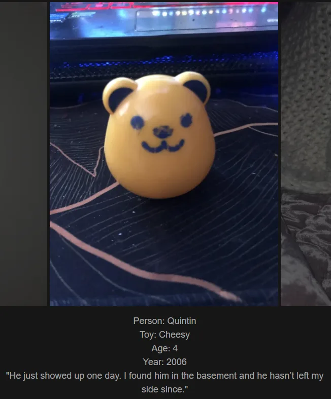 A close-up photo shows a small, yellow, round plastic toy with black marker drawn ears, eyes, and a smiling mouth, sitting…