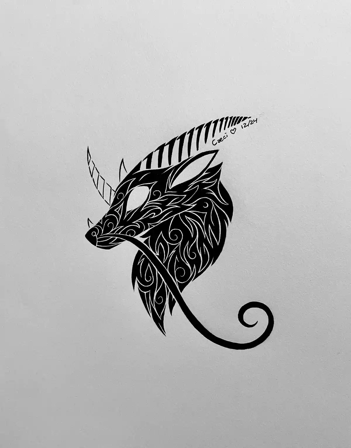 A black and white stylized drawing of a mythical creature's head, resembling a dragon or unicorn with a single horn…