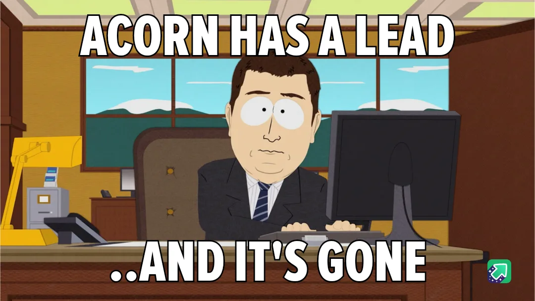 A cartoon man in a suit sits at a desk in an office with a computer, looking shocked. The text overlaid reads 'ACORN HAS A…