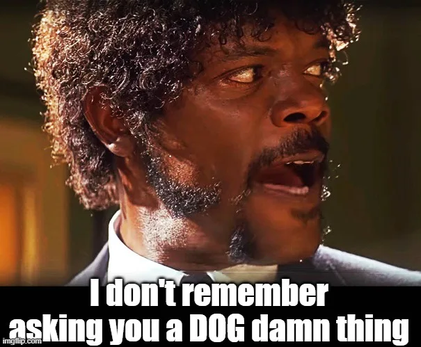 A close-up of actor Samuel L. Jackson with a shocked, incredulous expression, his mouth open and eyes wide. He is wearing a…