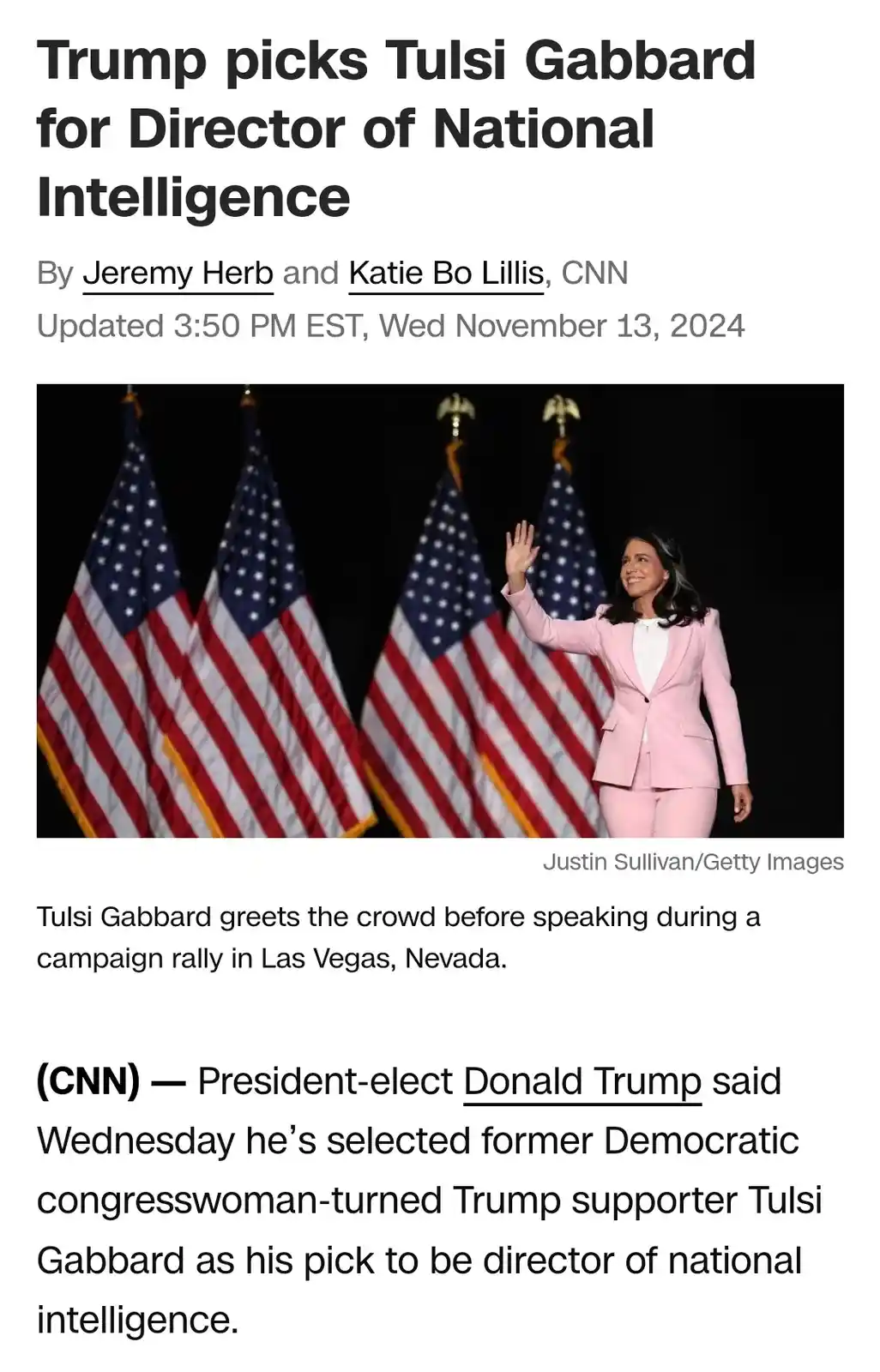 A screenshot of a CNN news article from November 13, 2024, shows a photo of Tulsi Gabbard in a pink suit waving in front of…