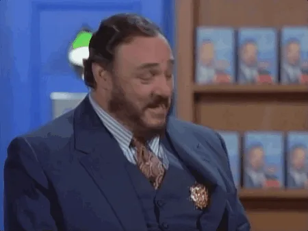 A man in a blue suit and tie, with a beard and mustache, is shown in six panels. He starts looking down, then looks up with…