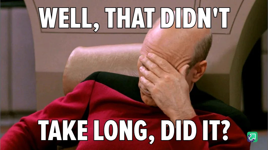 A bald man in a red uniform sits in a chair, covering his face with his hand in a gesture of exasperation or disappointment…