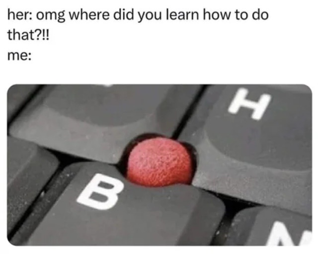 A close-up photo of a red, round, textured object stuck between the 'B' and 'H' keys on a black keyboard. The overlaid text…