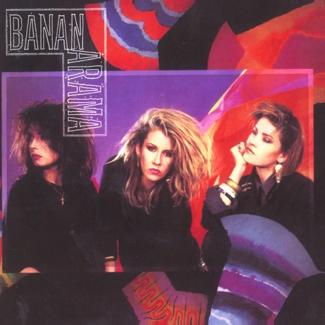 The image shows the 1980s pop group Bananarama on their album cover, with three women posing against a vibrant, abstract…