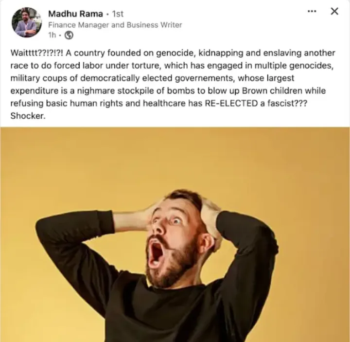 A man with a beard and black shirt holds his head in shock with his mouth wide open, set against a plain yellow background…