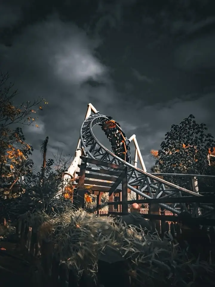 The thrilling ride of a roller coaster.