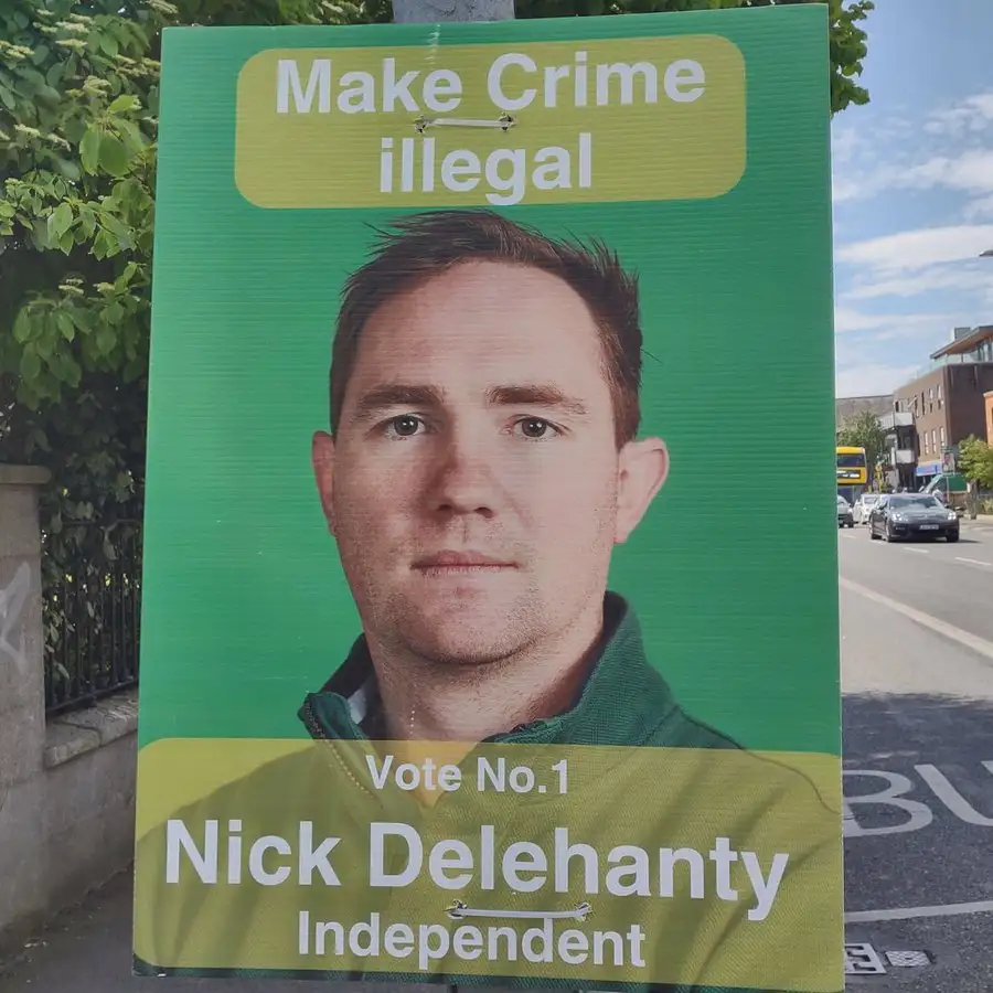 A green political campaign poster for Nick Delehanty, an independent candidate, features his headshot and the slogan 'Make…