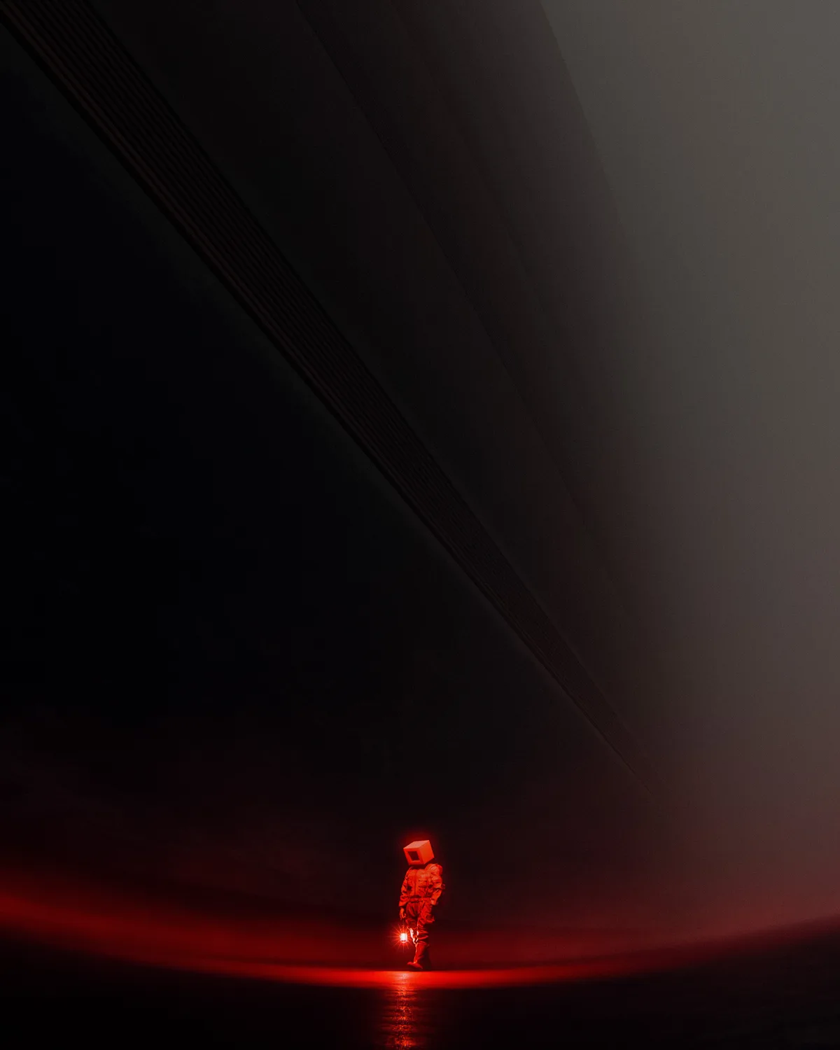 A person wearing a full-body suit and a glowing red cube for a head stands alone in a dark, vast tunnel, illuminated by a…