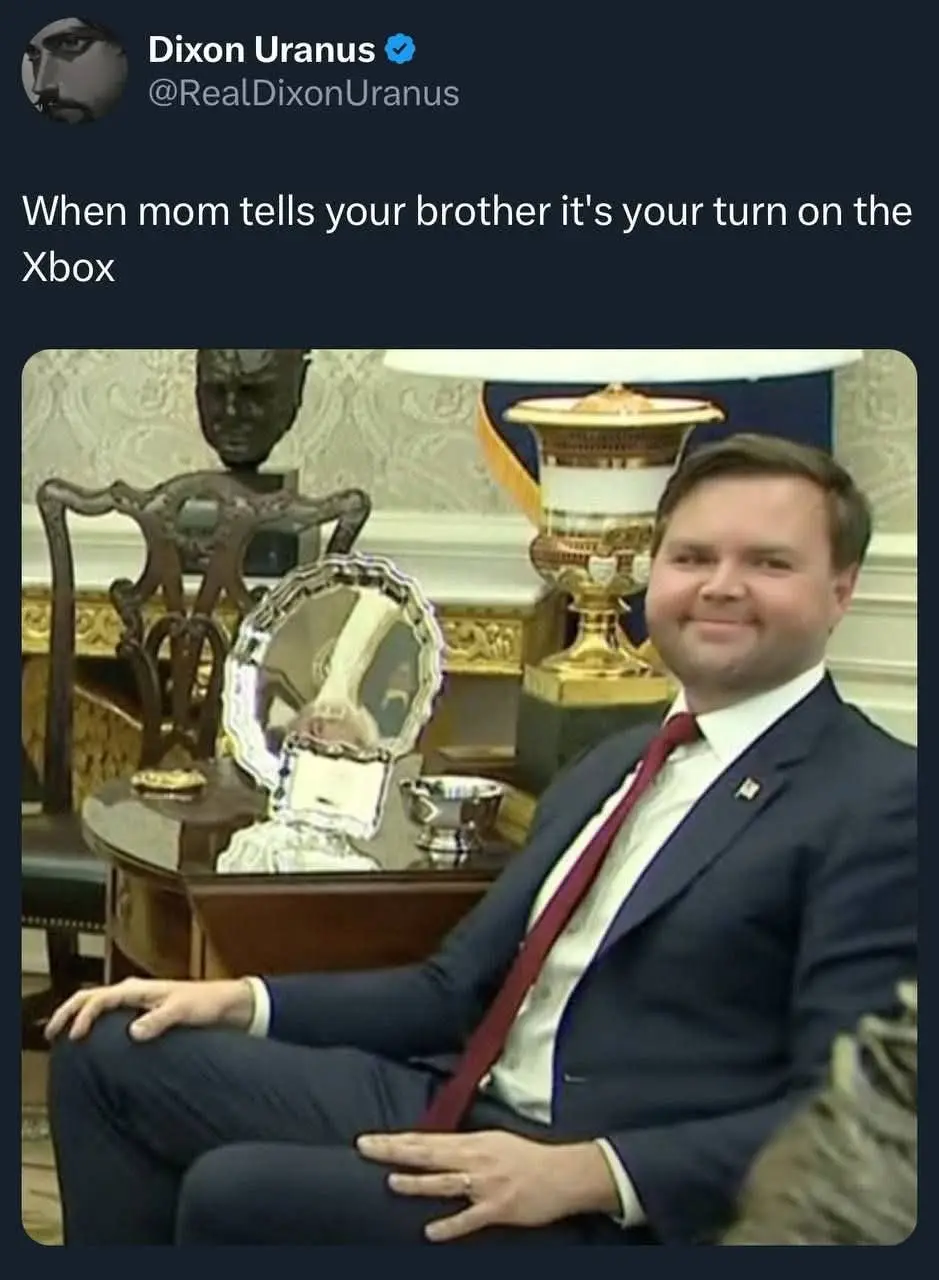 A screenshot of a tweet by Dixon Uranus shows a man in a suit sitting confidently in an ornate room. He has a smug…