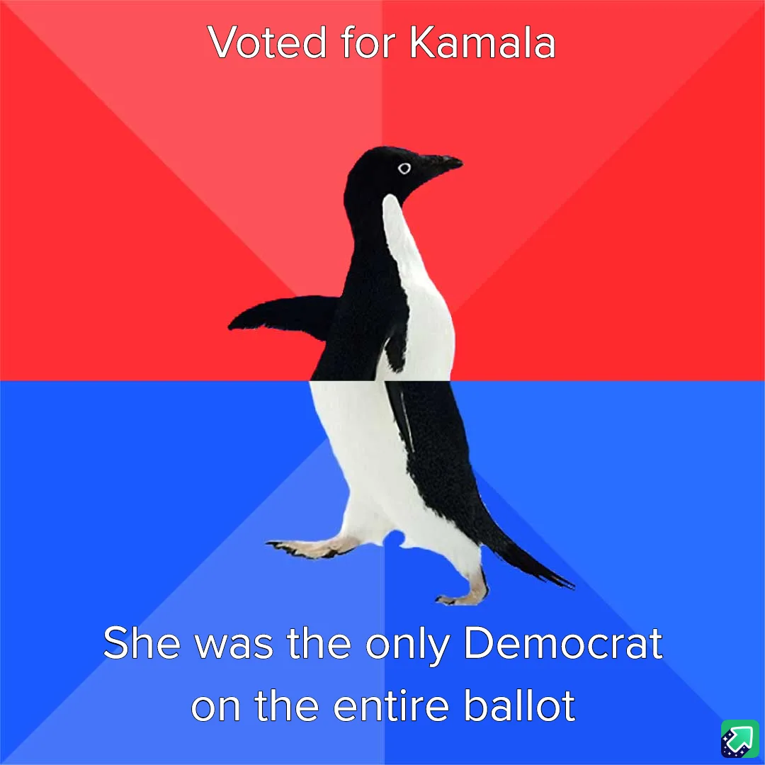 A penguin stands centered against a red and blue background, with white text above reading 'Voted for Kamala' and below…