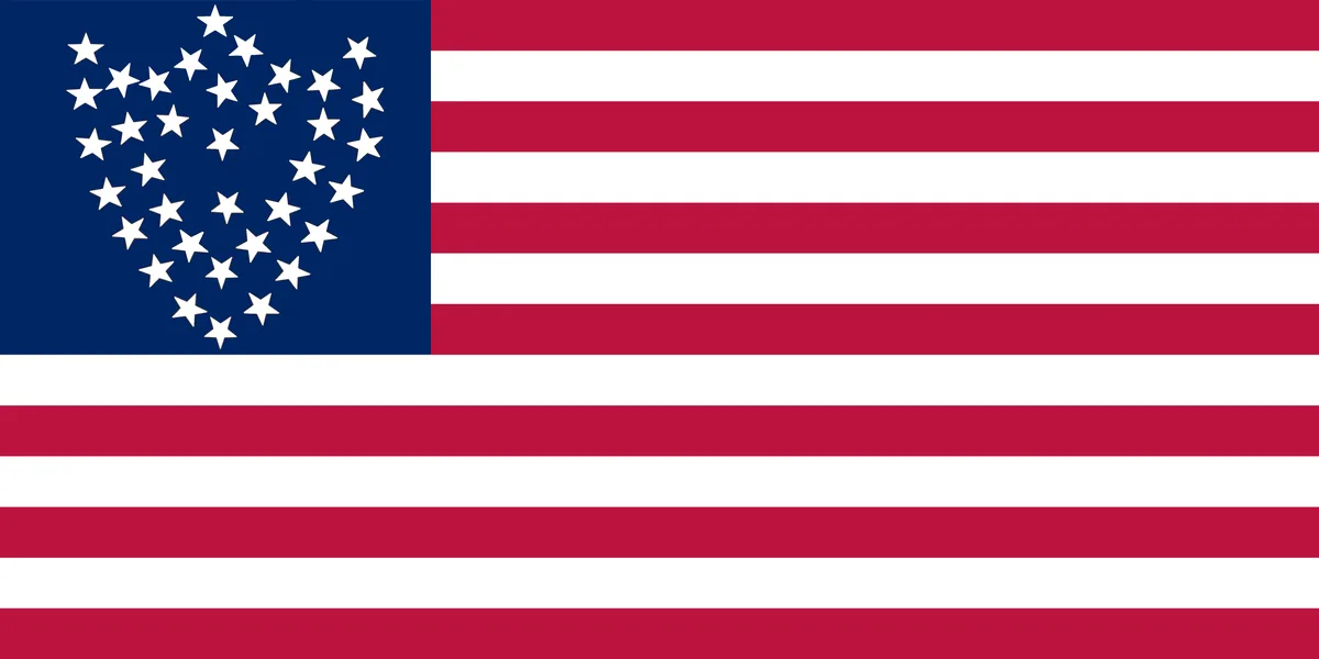 The image shows the American flag with its stars rearranged into a heart shape in the canton, while the stripes remain…