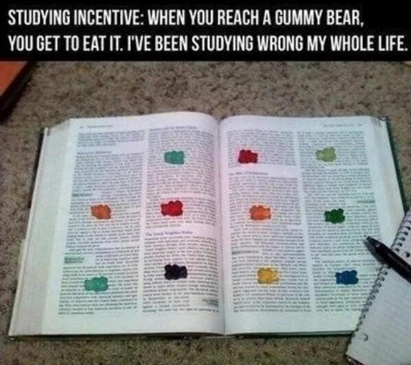 An open book with multiple colorful gummy bears placed on the pages, overlaid with text that reads 'STUDYING INCENTIVE: WHEN…
