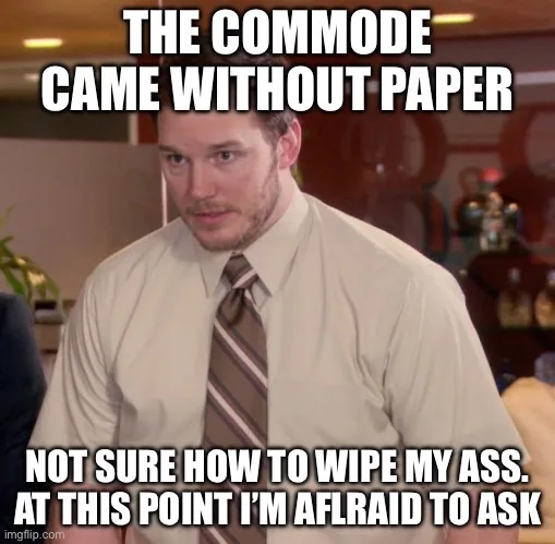 A man in a beige shirt and striped tie looks confused and slightly distressed. The overlaid text reads 'THE COMMODE CAME…