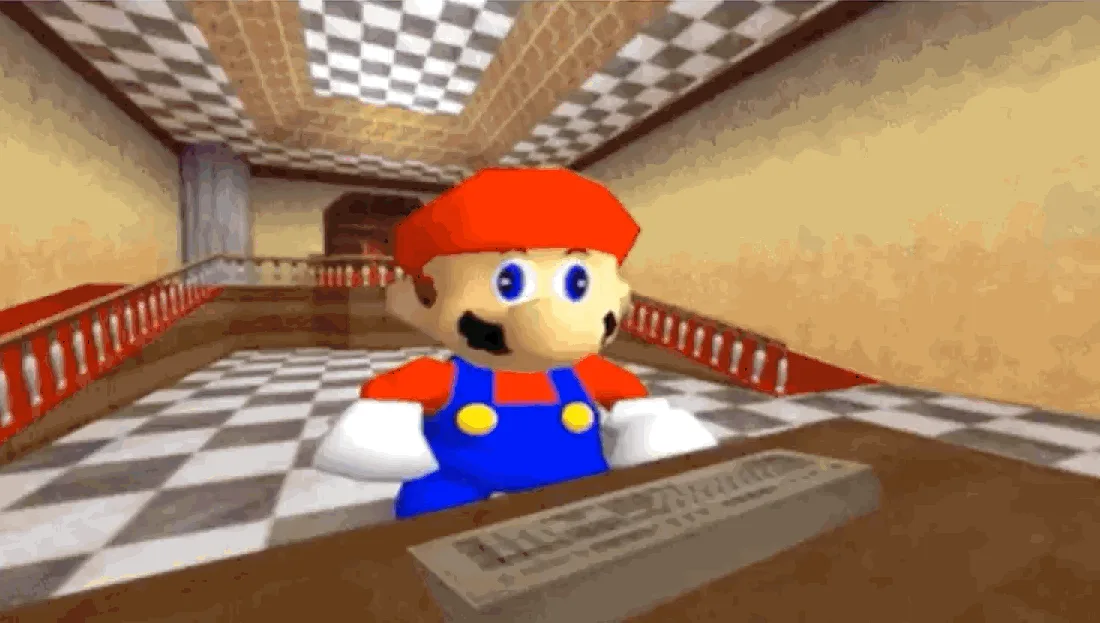 The image shows a sequence of six panels featuring the video game character Mario sitting at a desk with a keyboard…