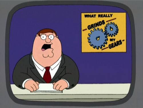 A cartoon man in a suit and red tie sits at a desk looking shocked, framed as if on a TV screen. Behind him, a yellow sign…