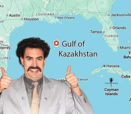 A man with a mustache and gray suit gives two thumbs up while superimposed over a map of the Gulf of Mexico. A red pin marks…
