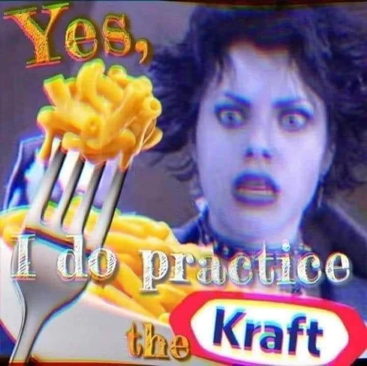A person with wide, startled eyes and dark makeup stares at a forkful of macaroni and cheese. The text 'Yes, I do practice…