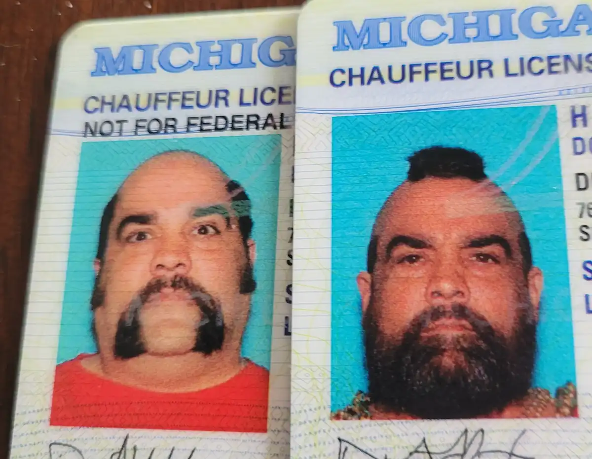 Two Michigan chauffeur licenses side by side show the same man with drastically different facial hair: one with a handlebar…